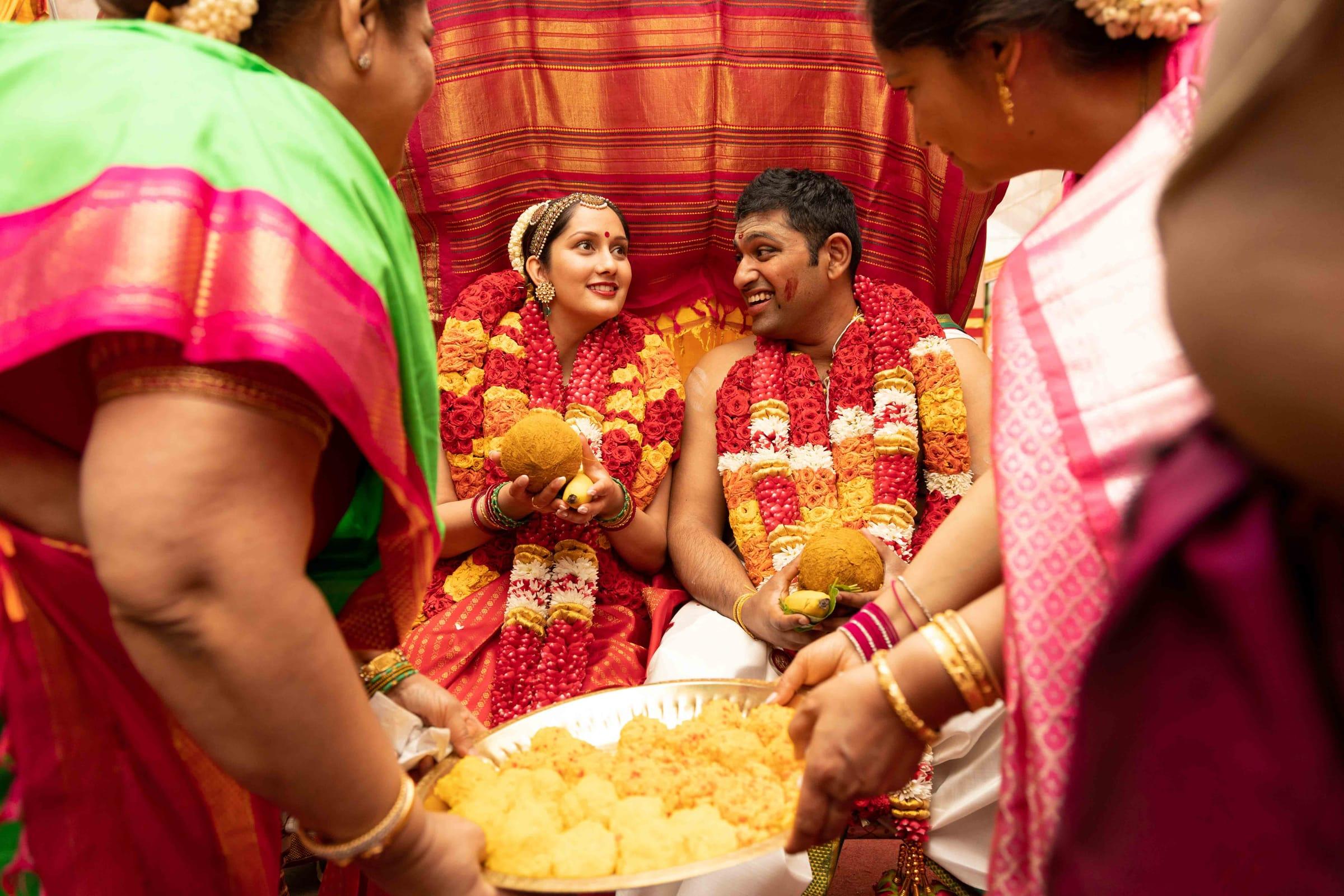 Wedding guests shower the bride and groom with blessings