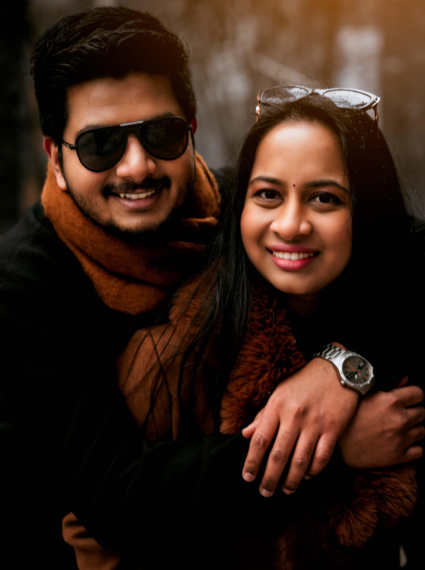 Engaged couple laughing together in an autumn portrait session